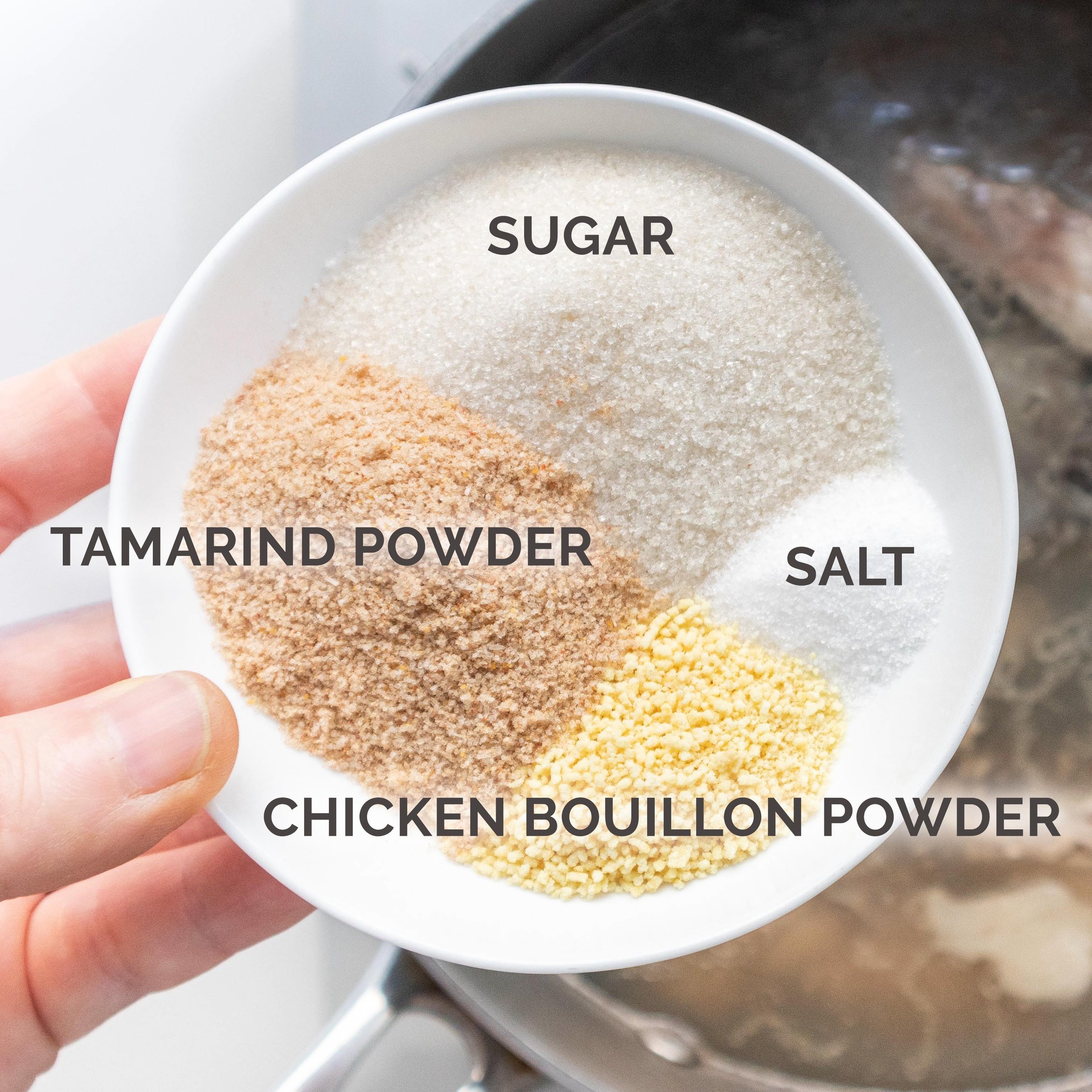 Seasonings for Canh Chua (sugar, salt, tamarind powder, and chicken bouillon powder)