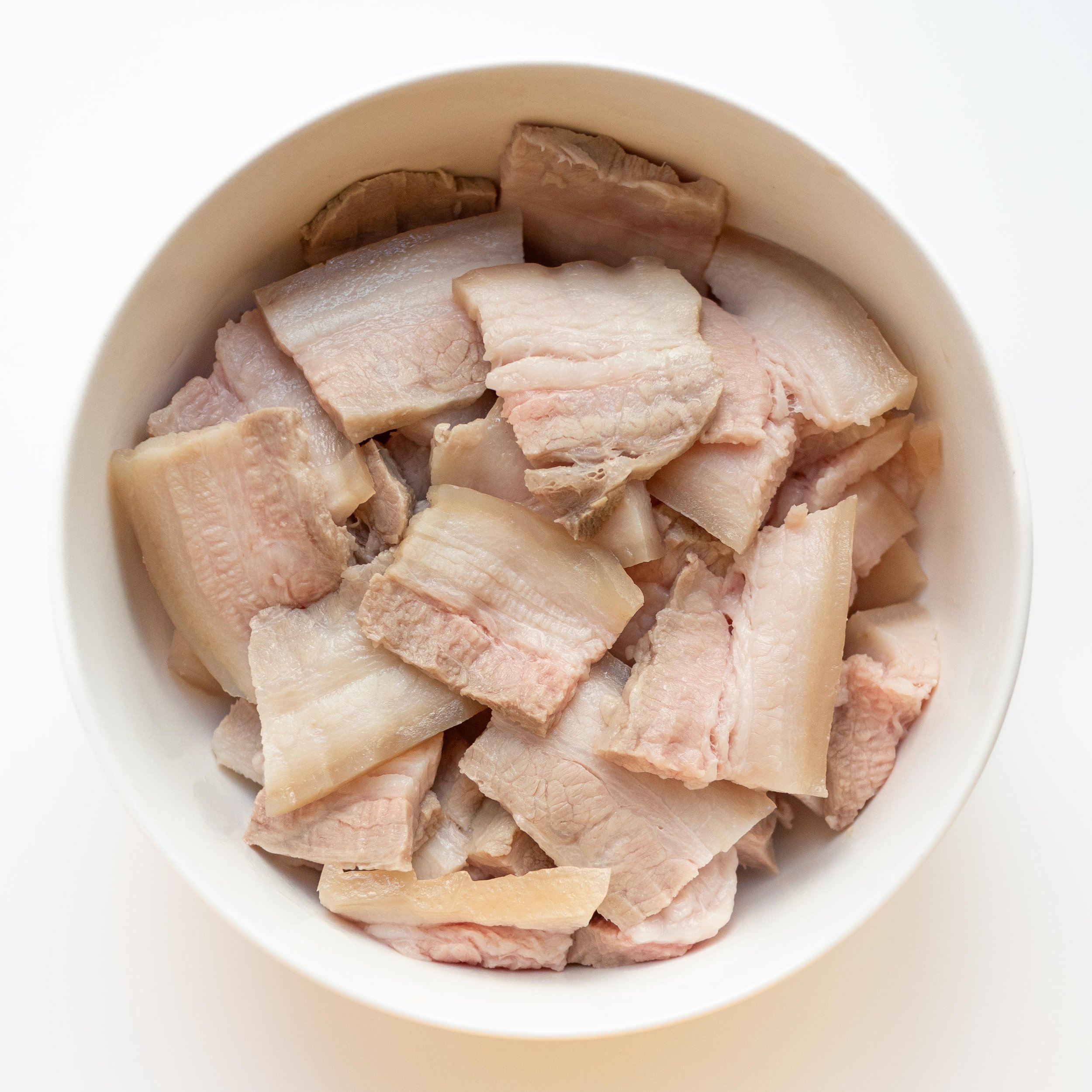 Sliced pork belly into bite-sized pieces