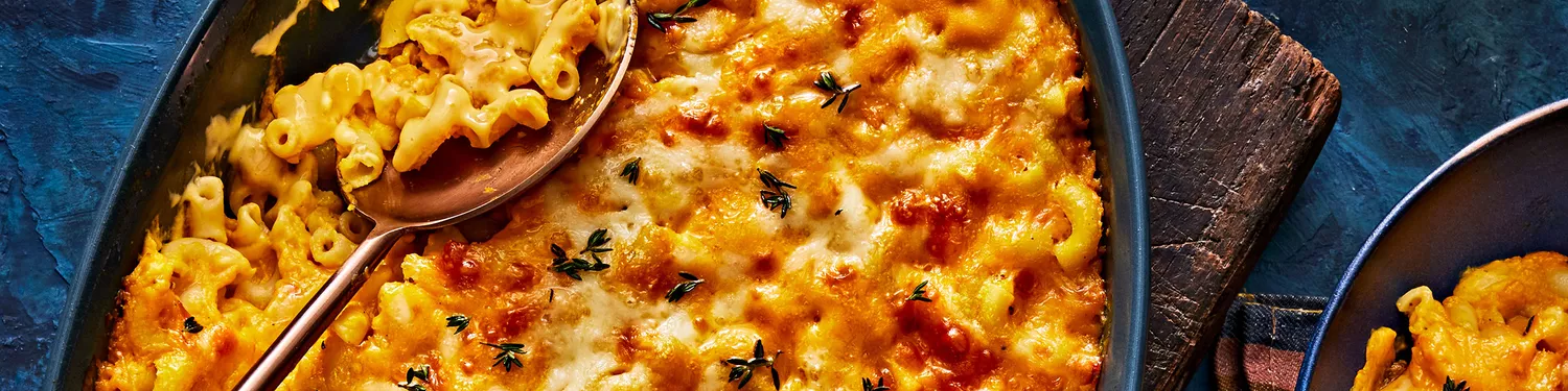 Butternut Squash Mac and Cheese with serving spoon